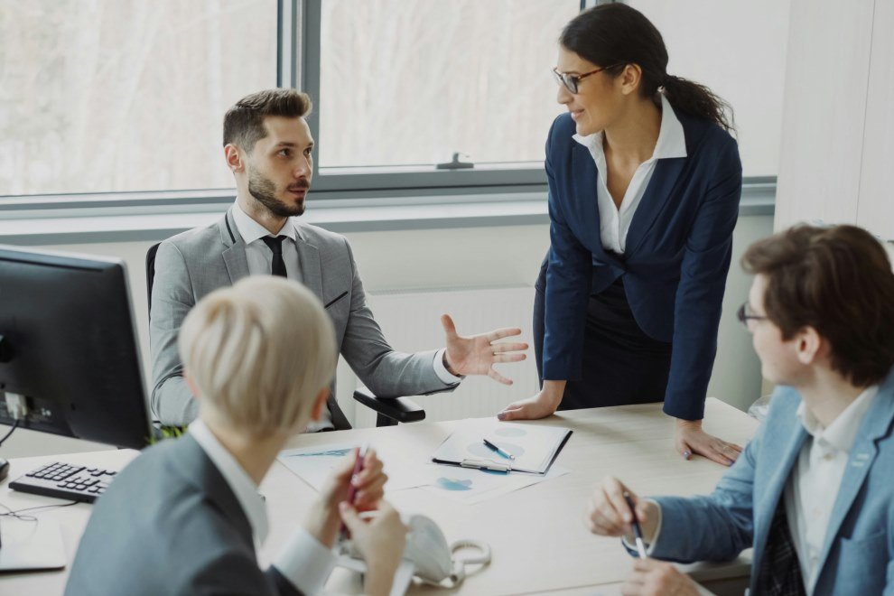 A good leader guiding a team at work A good leader guiding a team at work