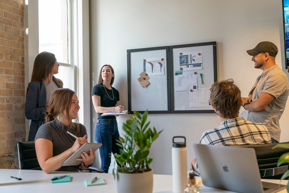 Leadership Skills Every Manager Needs Today Manager applying leadership skills with a team